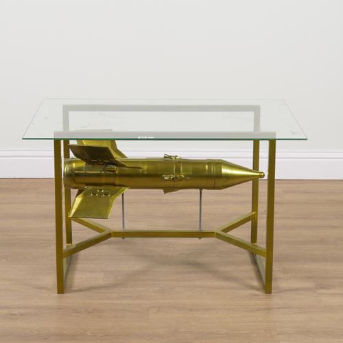 A GOLD PAINTED AND GLASS ROCKET COFFEE TABLE