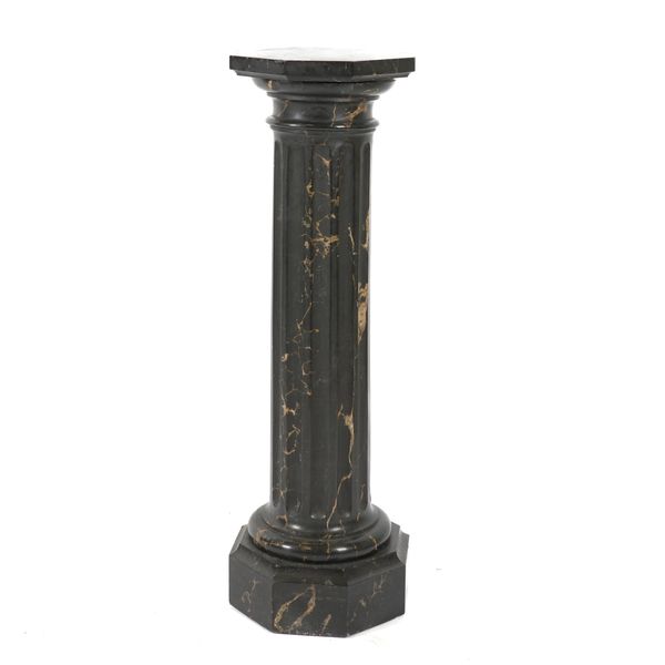 A PORTORO BLACK VARIGATED MARBLE FLUTED PEDESTAL COLUMN