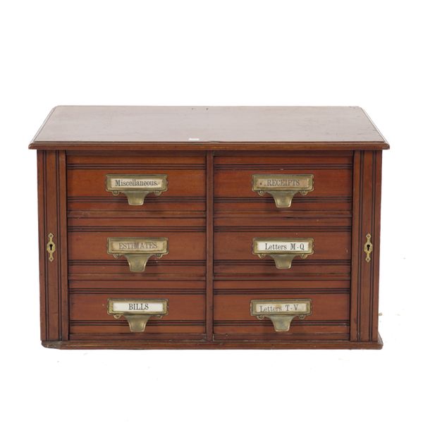 A 20TH CENTURY MAHOGANY SIX DRAWER DESK TOP WELLINGTON CHEST