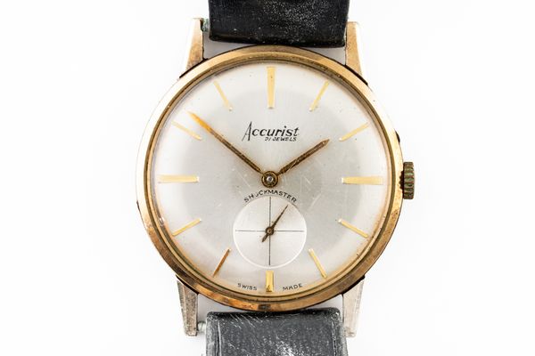 AN ACCURIST 9CT GOLD CASED GENTLEMAN'S WRISTWATCH