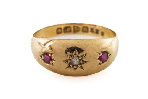 A RUBY AND DIAMOND THREE STONE RING