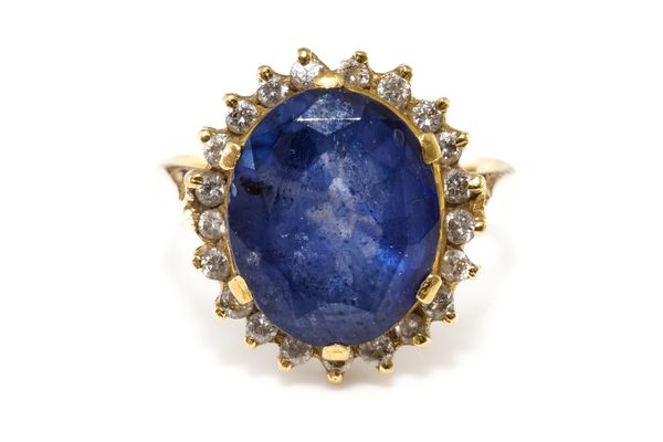 A SAPPHIRE AND DIAMOND CLUSTER RING