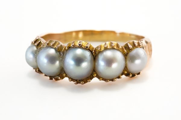 A GOLD AND HALF PEARL RING