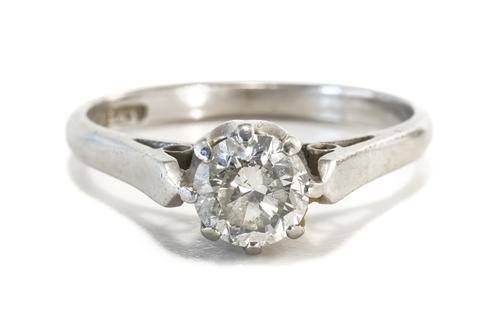 A PLATINUM AND DIAMOND SINGLE STONE RING