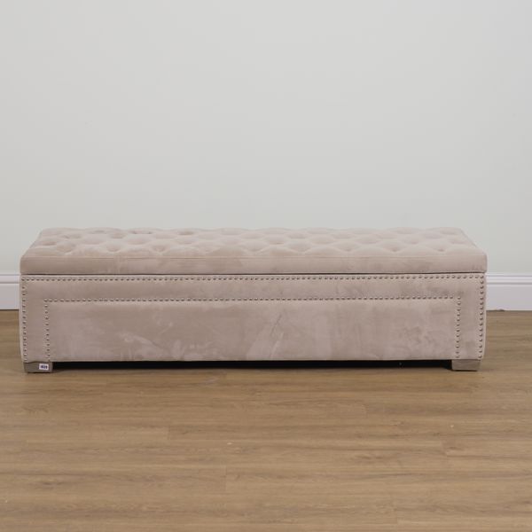 A CREAM BUTTONBACK UPHOLSTERED RECTANGULAR LIFT TOP OTTOMAN