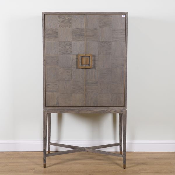 A GREY HARDWOOD CABINET ON STAND