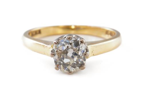 AN 18CT GOLD AND DIAMOND SINGLE STONE RING