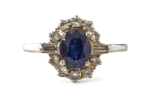 A SAPPHIRE AND DIAMOND OVAL CLUSTER RING