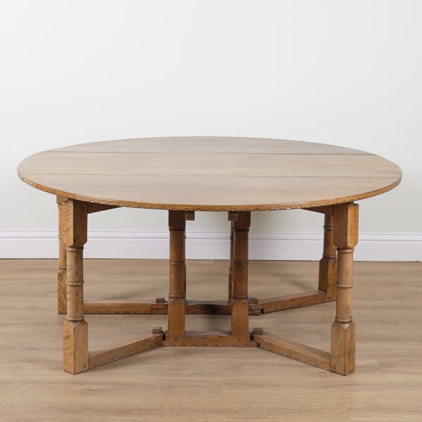 NIGEL GRIFFITHS; A 20TH CENTURY OAK GATELEG TABLE