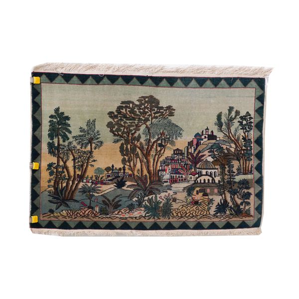 A PICTORIAL RUG OF A TOWN AND LANDSCAPE