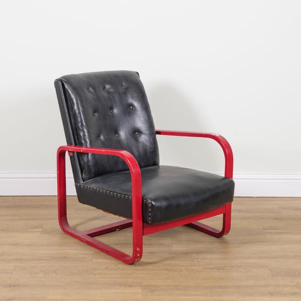 IN THE MANNER OF ALVAR AALTO; A RED PAINTED PLYWOOD LOW ARMCHAIR