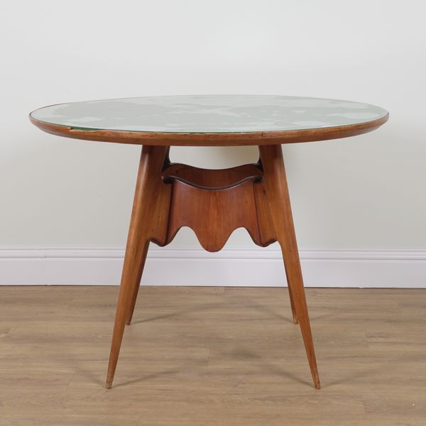 A MID 20TH CENTURY GLASS TOPPED WALNUT CIRCULAR TABLE