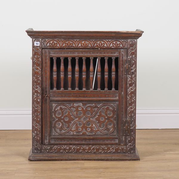 A 17TH CENTURY OAK HANGING FOOD CUPBOARD