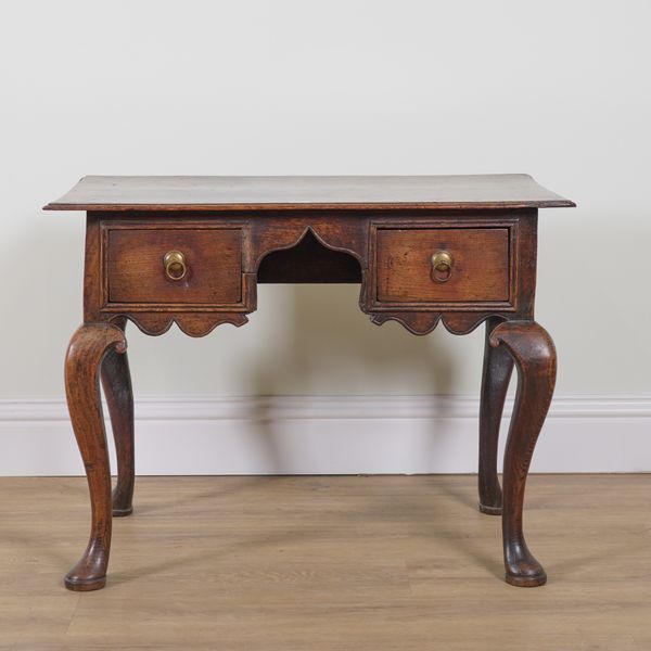 AN EARLY 18TH CENTURY OAK TWO DRAWER LOWBOY