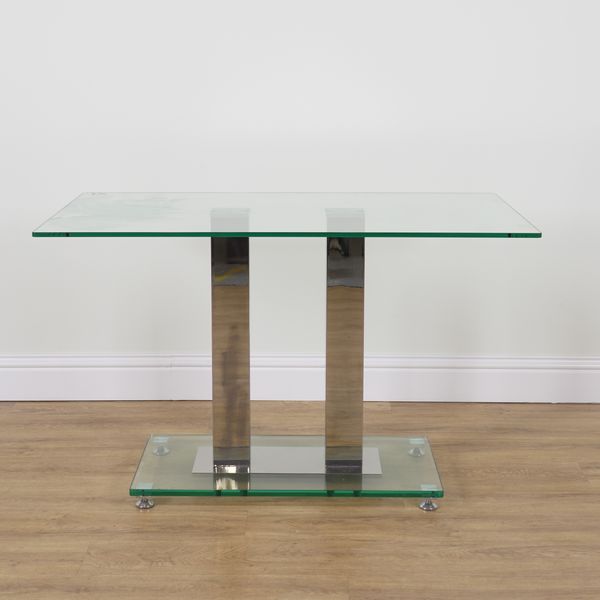 A GLASS AND CHROME RECTANGULAR DINING TABLE