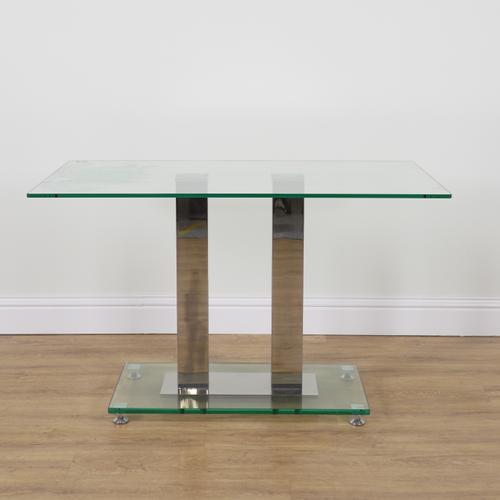 A GLASS AND CHROME RECTANGULAR DINING TABLE