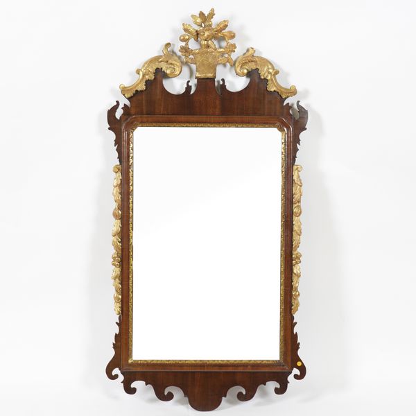 A MID 19TH CENTURY PARCEL GILT FRET CARVED WALL MIRROR