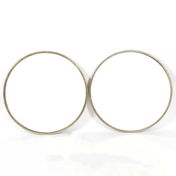 A PAIR OF MODERN METAL FRAMED CIRCULAR WALL MIRRORS (2)