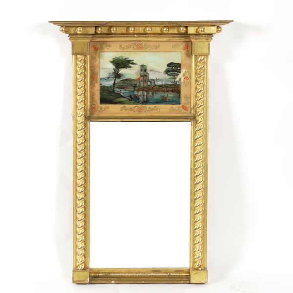 AN EARLY 19TH CENTURY GILT FRAMED TRUMEAU MIRROR