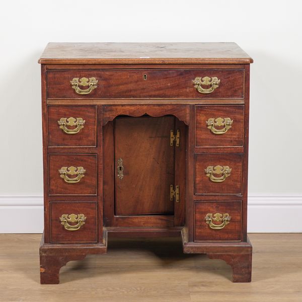 A GEORGE II MAHOGANY KNEEHOLE DESK