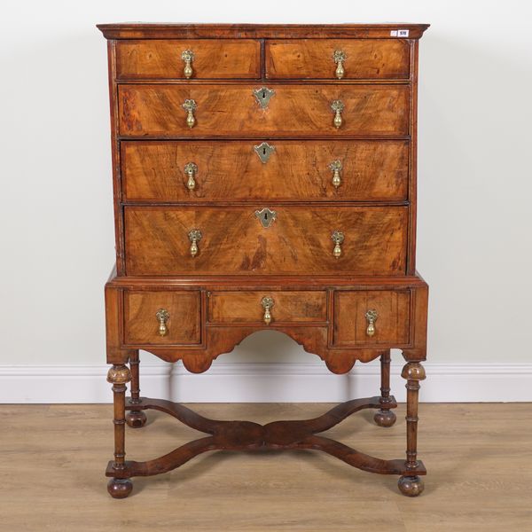 A GEORGE I AND LATER FIGURED WALNUT FIVE DRAWER CHEST