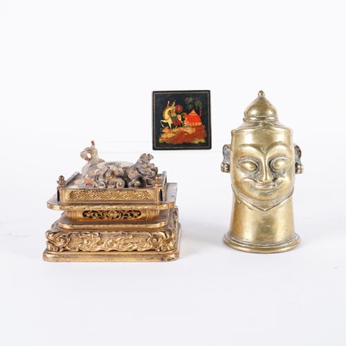 AN INDIAN BRONZE LINGAM COVER MODELLED AS HEAD,  PROBABLY SIVA (3)