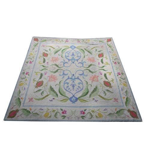 A LARGE PORTUGUESE NEEDLEWORK CARPET