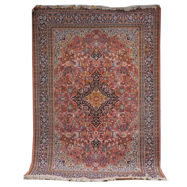 A CHINESE SILK CARPET OF PERSIAN DESIGN AND A SILK KHOM RUG (2)