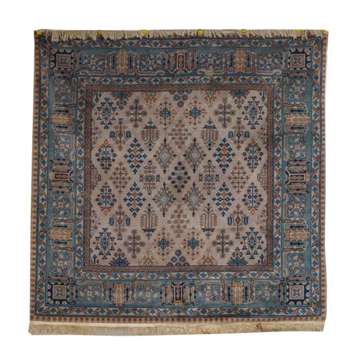 A CHINESE RUG OF PERSIAN DESIGN AND A RED NEPALESE CARPET (2)