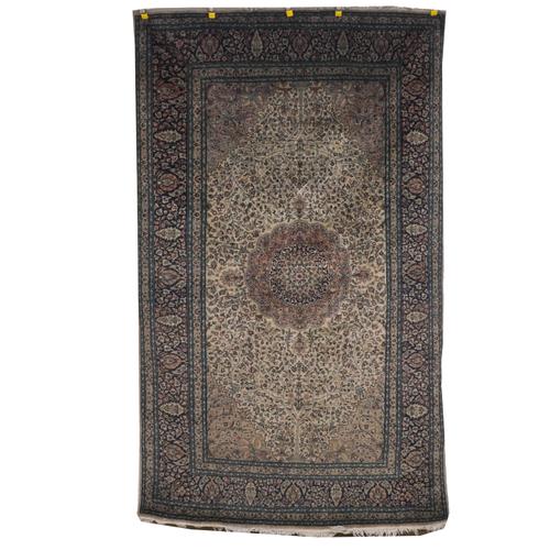 AN INDIAN RUG WITH ANOTHER INDIAN RUG (2)