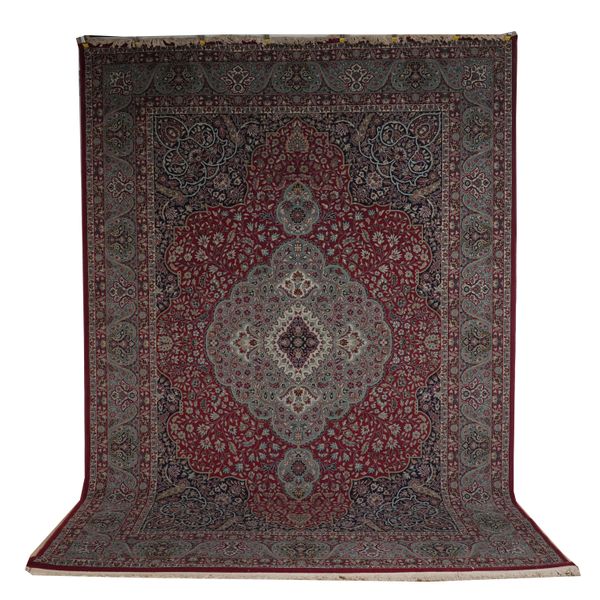 A MACHINE MADE CARPET OF PERSIAN DESIGN