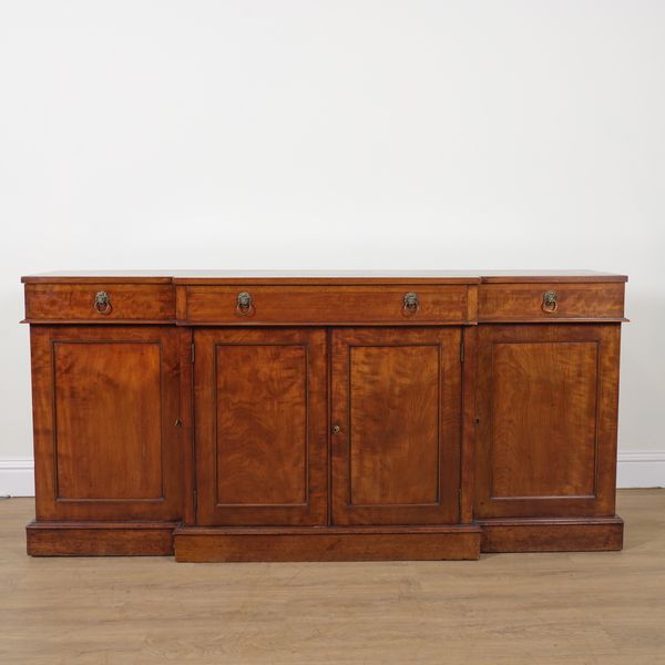 A GEORGE III MAHOGANY BREAKFRONT SIDEBOARD