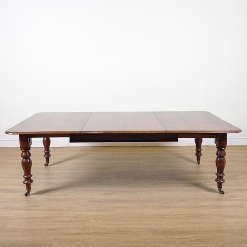 A REGENCY MAHOGANY EXTENDING DINING TABLE