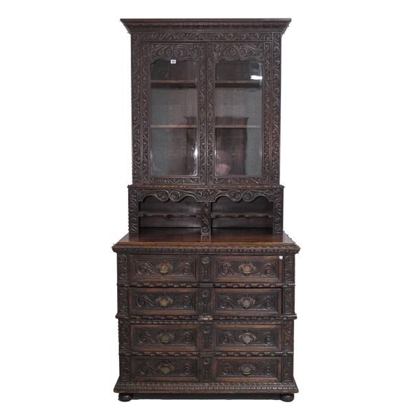 A VICTORIAN CARVED OAK GLAZED BOOKCASE/CHEST