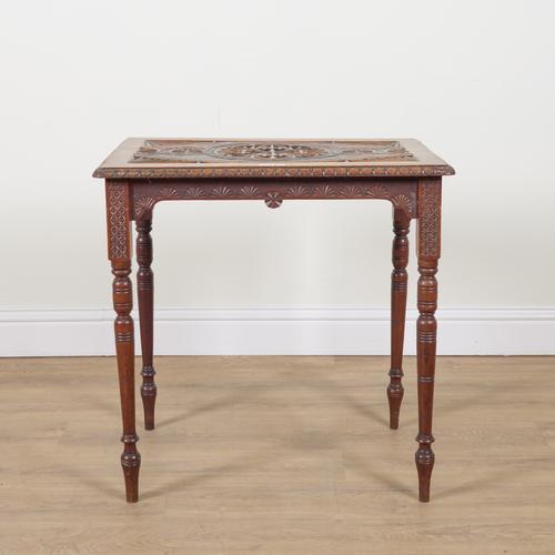 AN EARLY 20TH CENTURY CARVED WALNUT OCCASIONAL TABLE