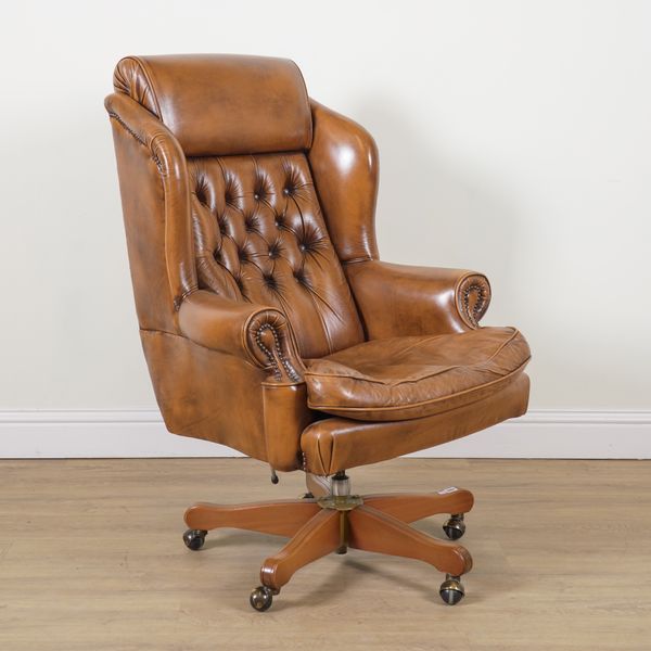 A 20TH CENTURY WINGBACK REVOLVING DESK CHAIR