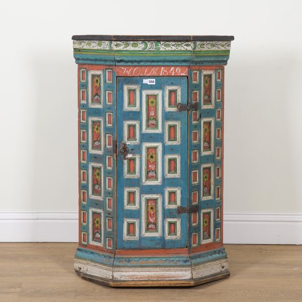 A MID 18TH CENTURY SWEDISH POLYCHROME PAINTED HANGING CORNER CUPBOARD