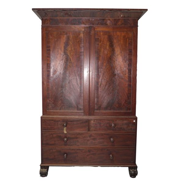 AN EARLY VICTORIAN MAHOGANY LINEN PRESS