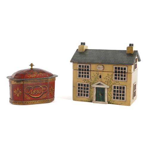 A TEA CADDY IN THE FORM OF A HOUSE AND A LEAD TOBACCO BOX (2)