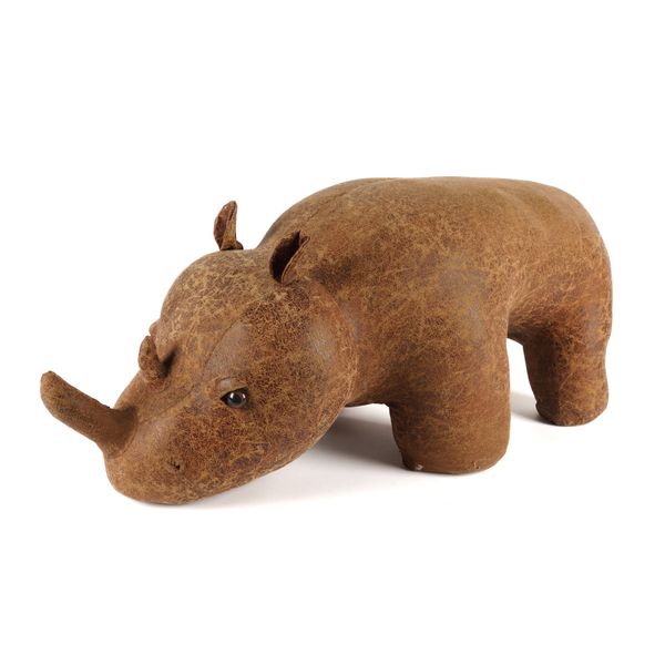 A FAUX DISTRESSED LEATHER UPHOLSTERED RHINO STOOL