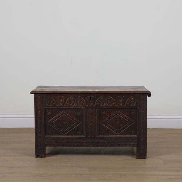 A MID 17TH CENTURY CARVED OAK COFFER