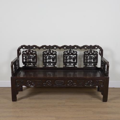 A CHINESE STAINED HARDWOOD BENCH