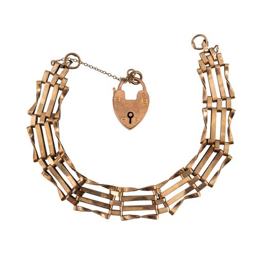 A 9CT GOLD BAR AND TWISTED BAR LINK GATE BRACELET