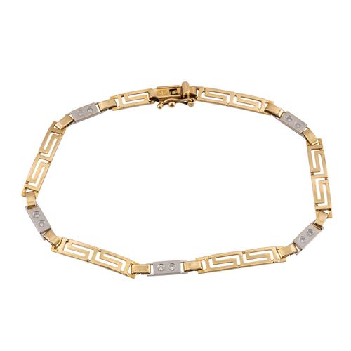 A GOLD AND COLOURLESS GEM SET BRACELET