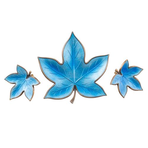 A DANISH SILVER GILT AND BLUE ENAMELLED BROOCH AND PAIR OF EARCLIPS (3)