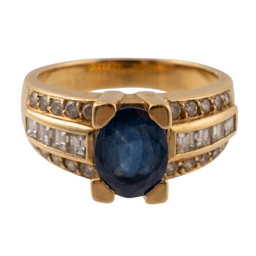 A SAPPHIRE AND DIAMOND RING