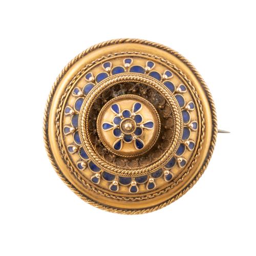 A VICTORIAN GOLD AND BLUE ENAMELLED CIRCULAR BROOCH