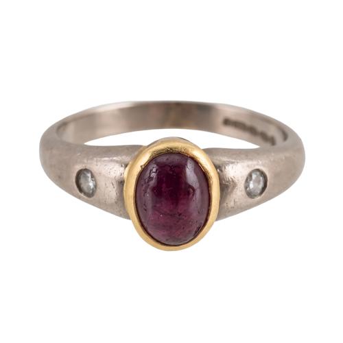 AN 18CT YELLOW AND WHITE GOLD CABOCHON RUBY AND DIAMOND THREE STONE RING