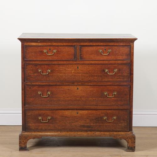 A GEORGE III OAK CHEST OF DRAWERS
