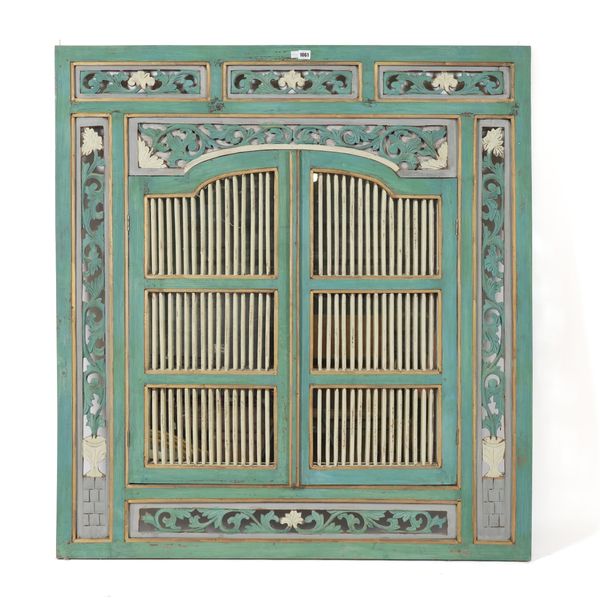 A 20TH CENTURY EASTERN POLYCHROME PAINTED MIRROR